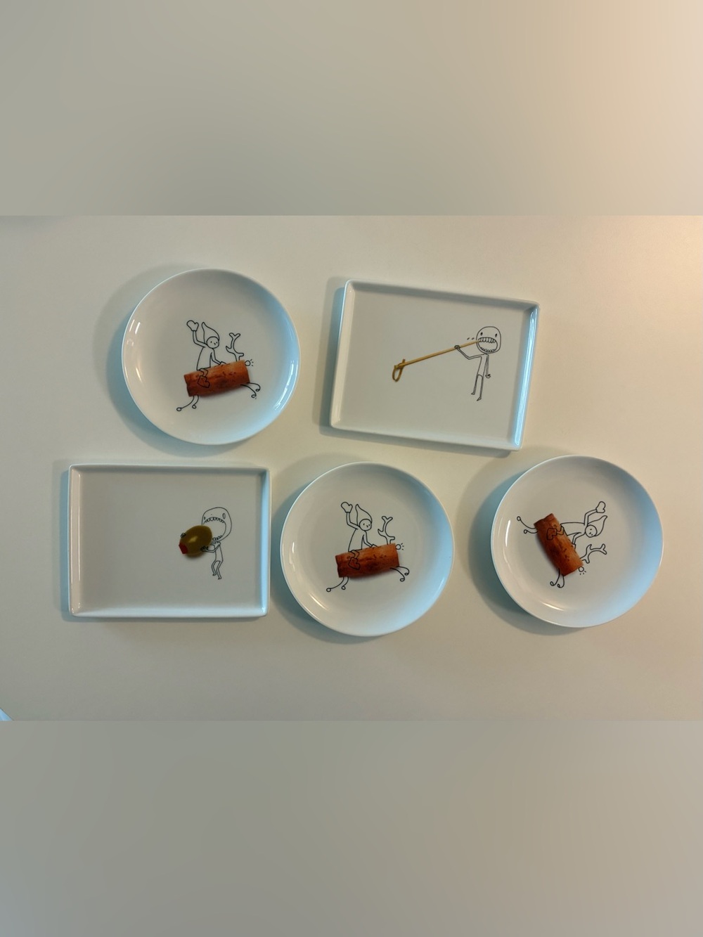 CB2 Oliver Appetizer Plates: Jana Kinsman Cartoon Olive Design